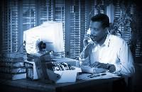 man on phone at desk